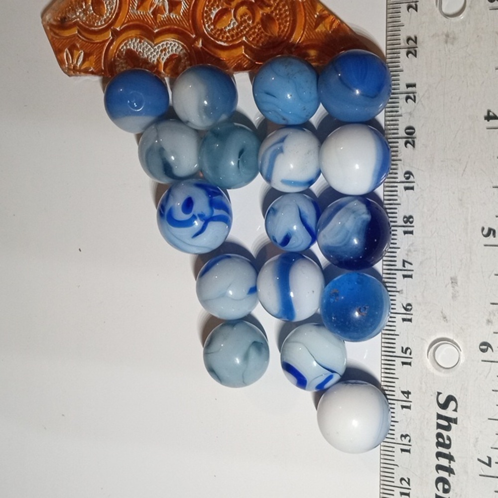 17 vintage swirl blue and white glass marbles. Hand blown and machined m…